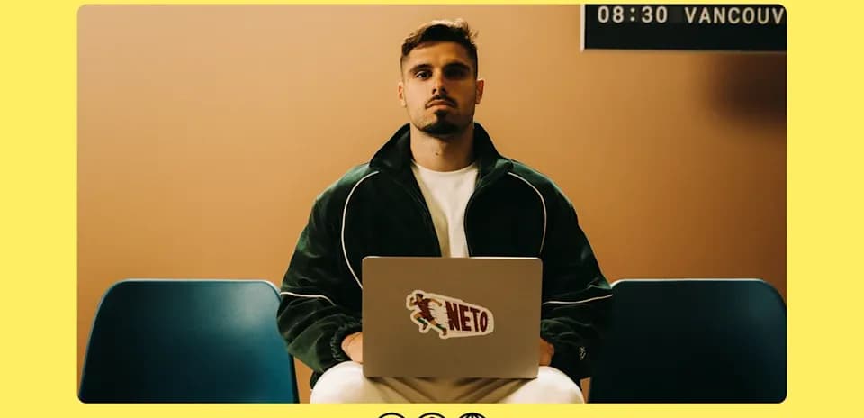 Person sitting with laptop in waiting area