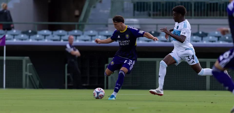 Orlando City II player dribbling against Crown Legacy