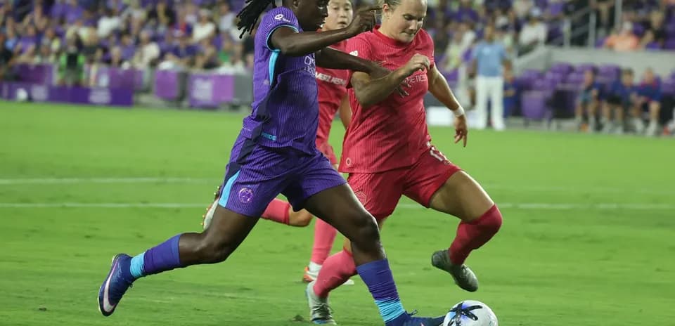 Boston Legacy W player tackling Orlando Pride W player