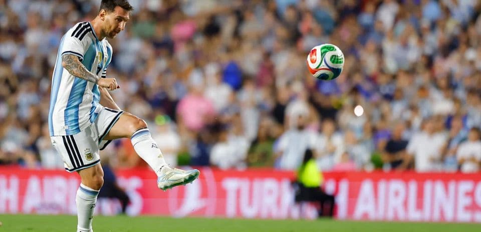 Player kicking a soccer ball during a match