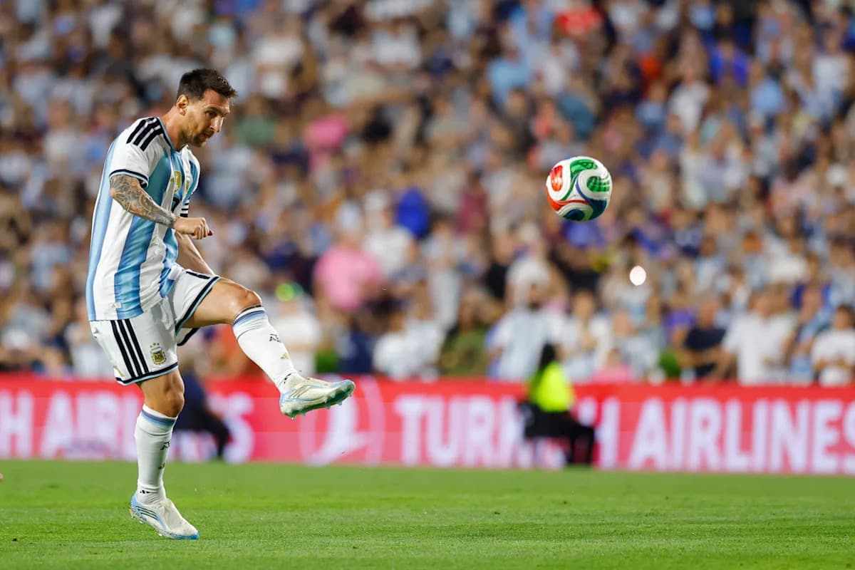 Player kicking a soccer ball during a match