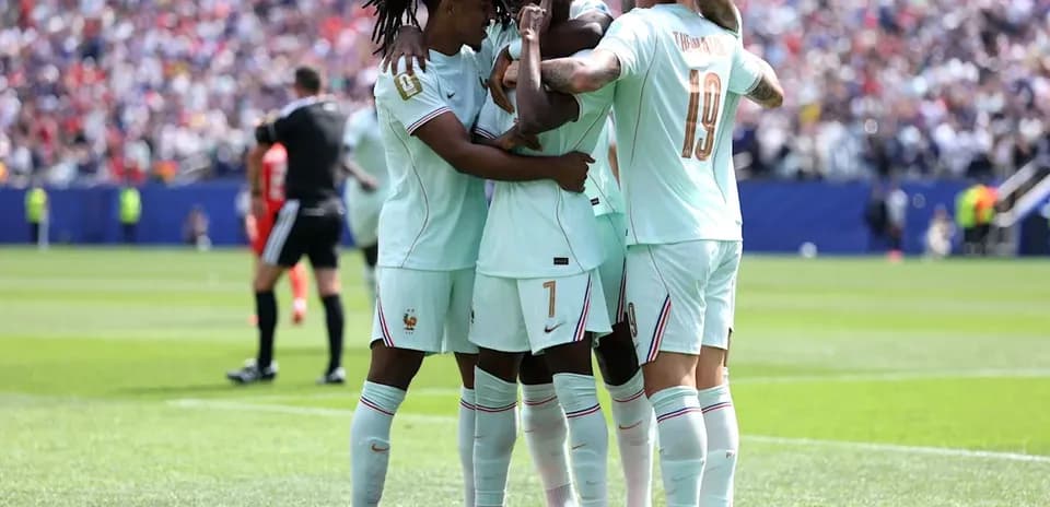 French players celebrating a goal on the field