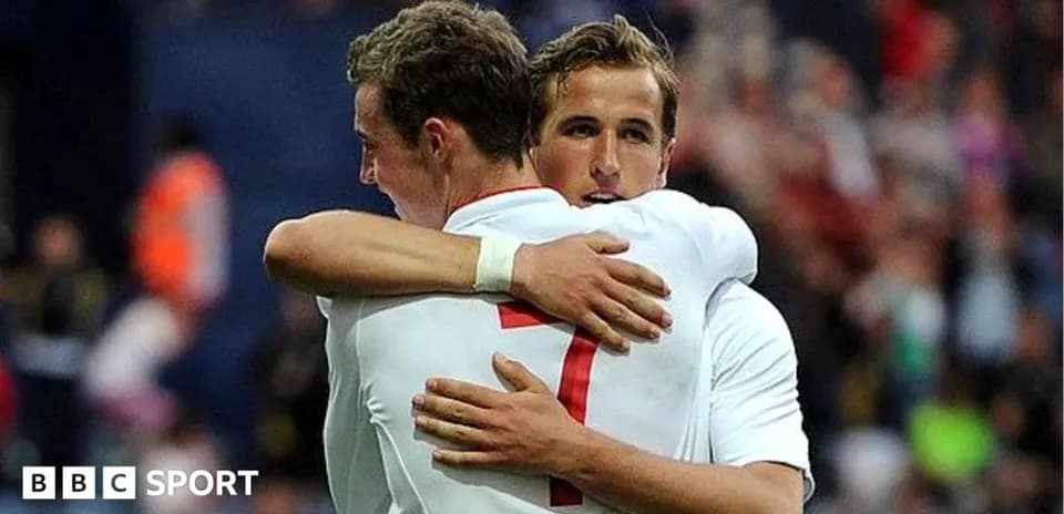 Two players embracing after a goal celebration