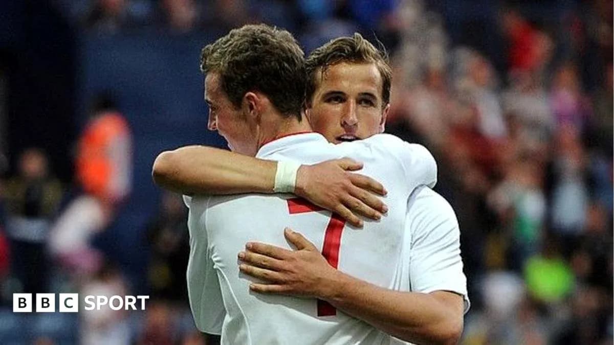 Two players embracing after a goal celebration