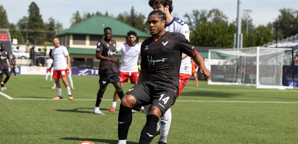 Player dribbling the ball during Vancouver FC match