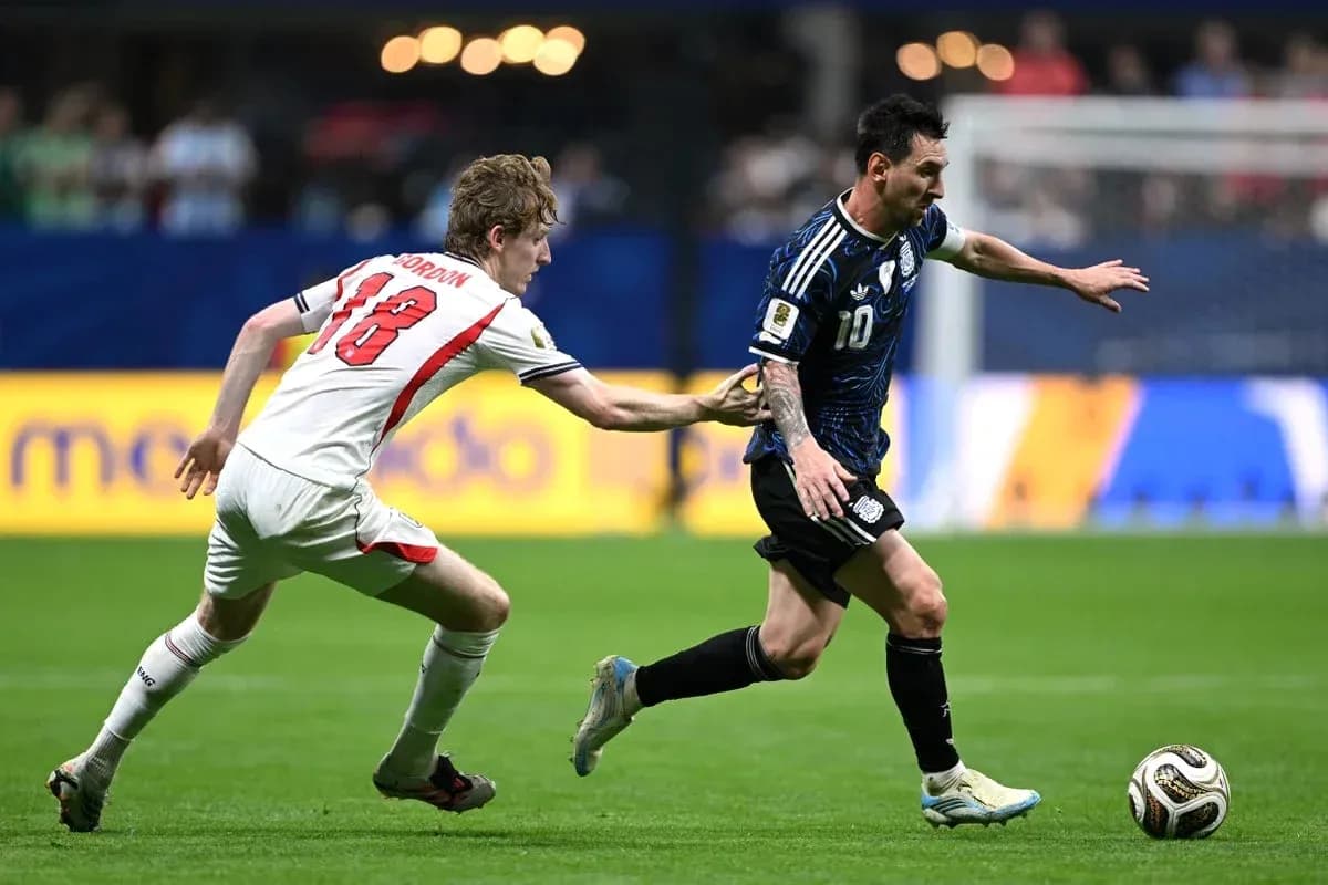 Player evading tackle while dribbling the ball