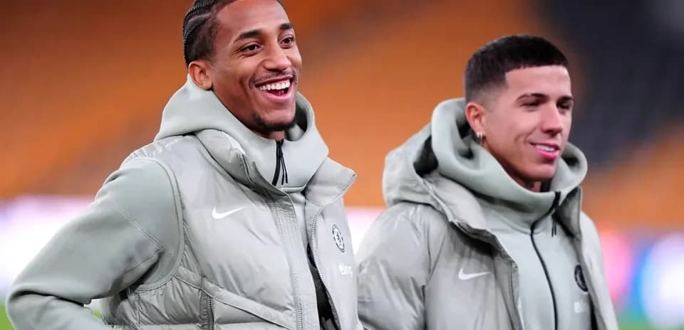Two players smiling during warm-up session