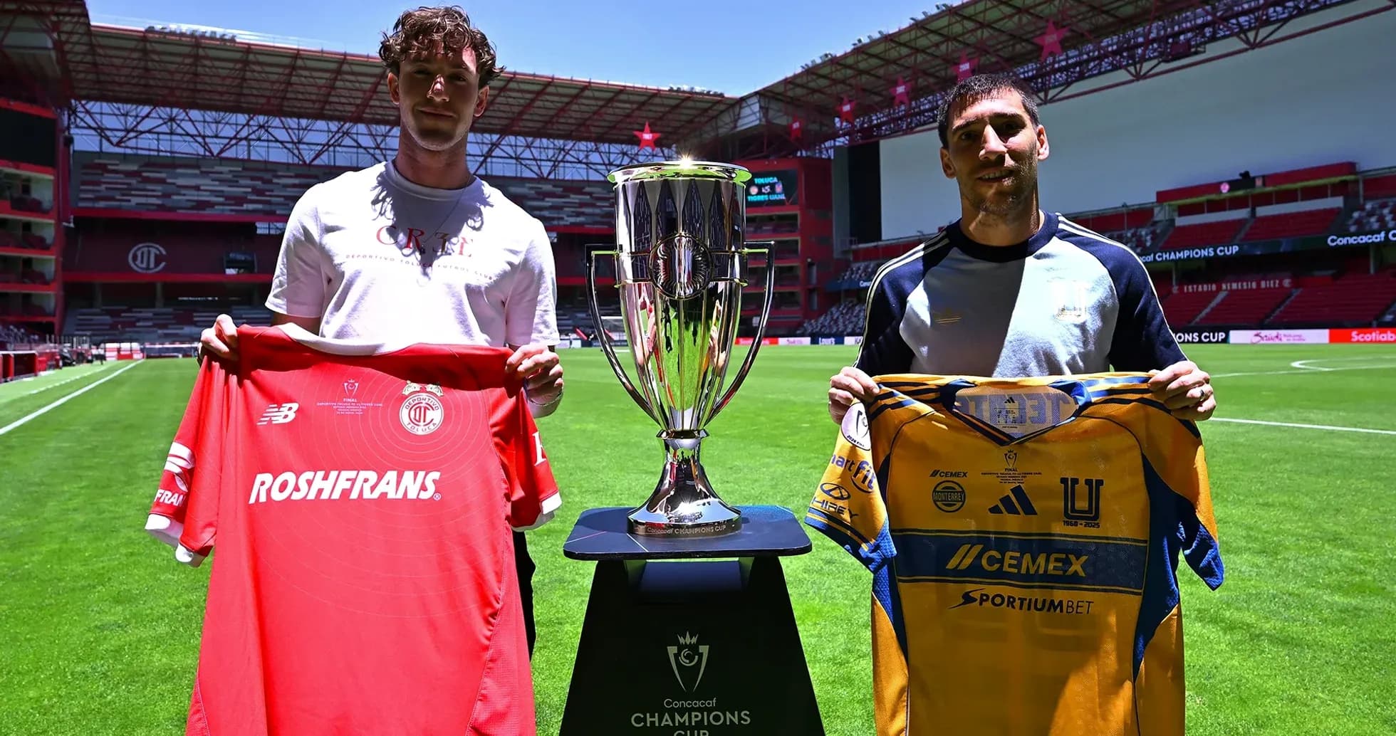 Players holding jerseys before Champions League match