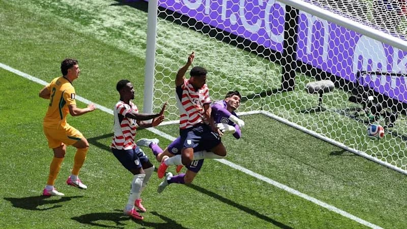 Players contesting a goal during soccer match