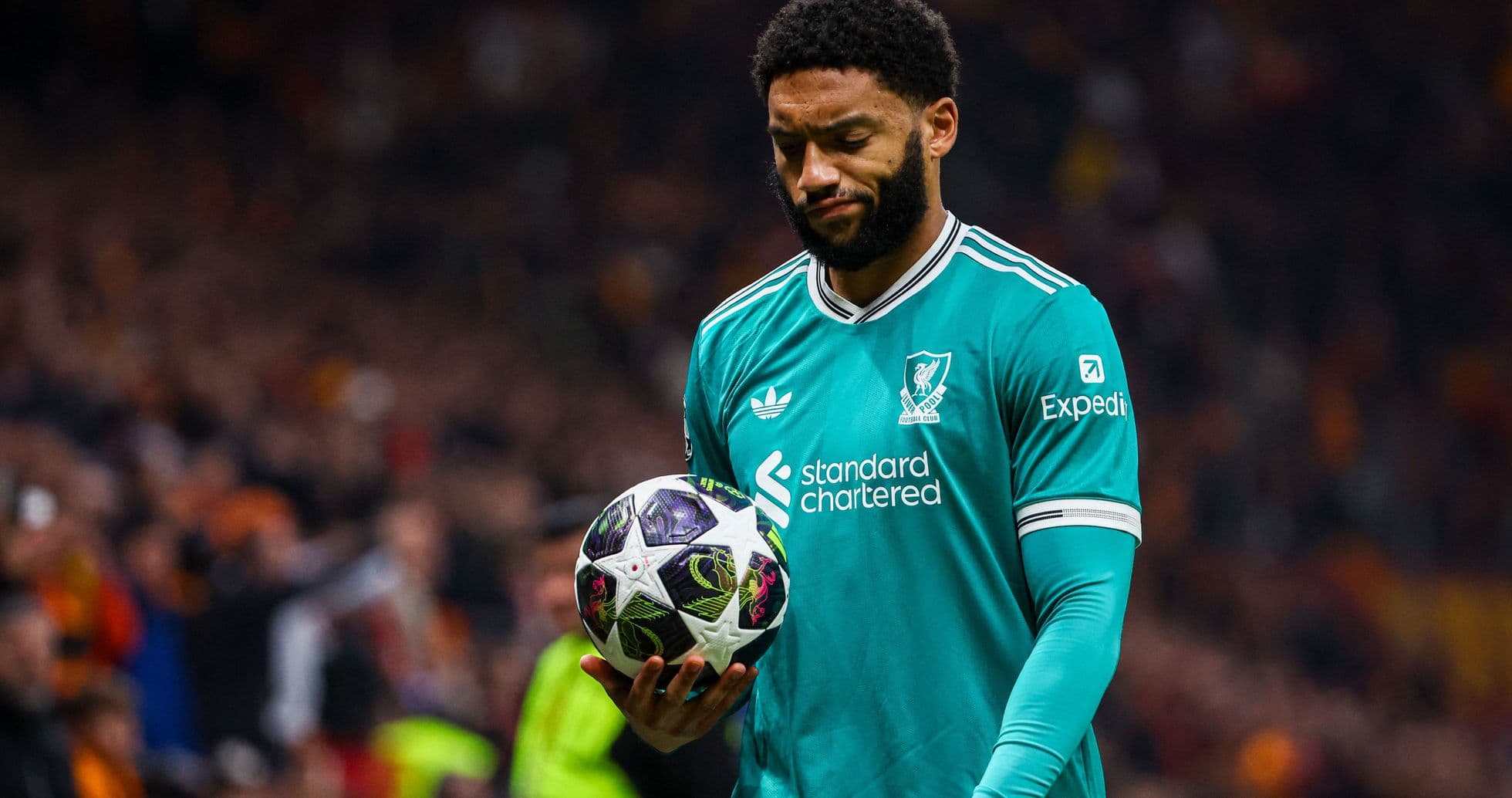 Player holding ball during match with focused expression