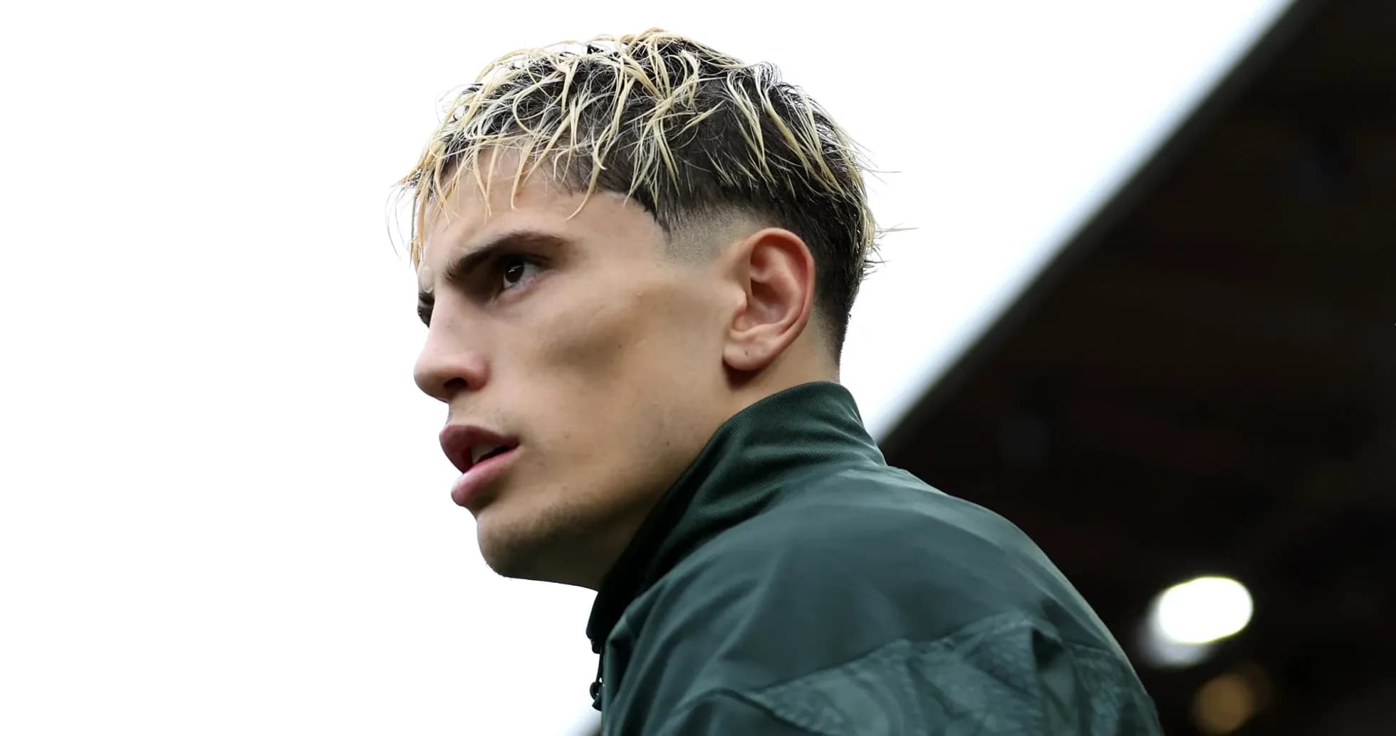 Player in training gear looking off into distance