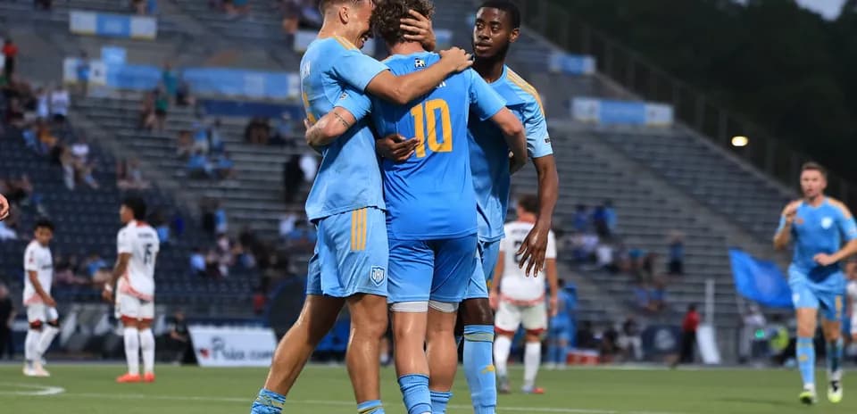 Players celebrating a goal during match