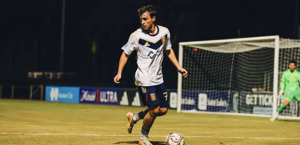 Player dribbling the ball during a match