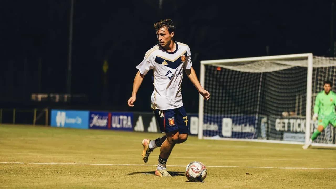 Player dribbling the ball during a match