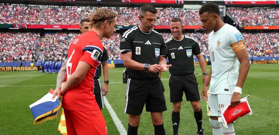 Team captains and referees at coin toss before match