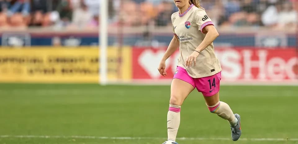 Player dribbling the ball during NWSL match