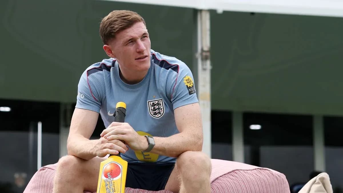 Player seated with a cricket bat during training