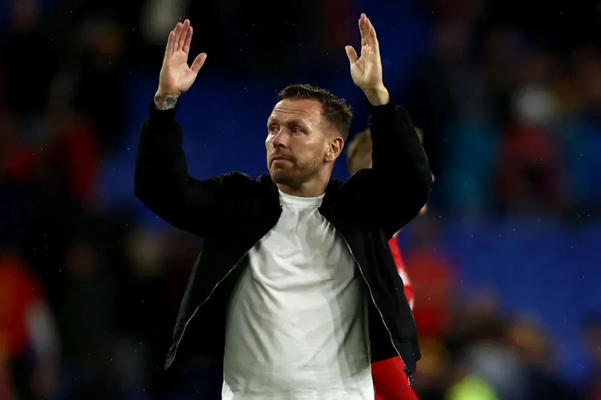 Man raising hands in acknowledgment after match