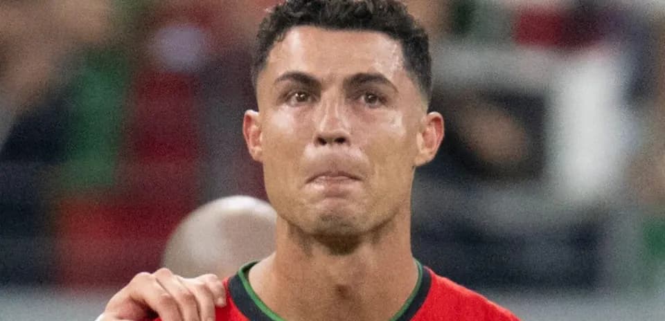 Player in red jersey during match celebration
