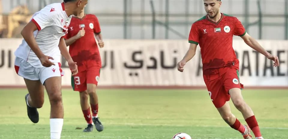 Al Sharjah U23 player dribbling during match