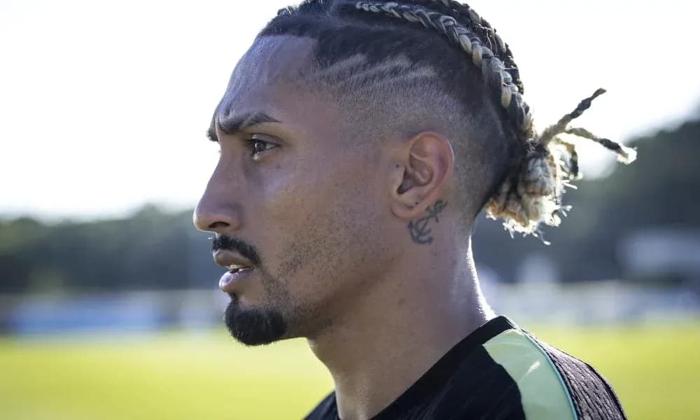 Profile view of a football player in training