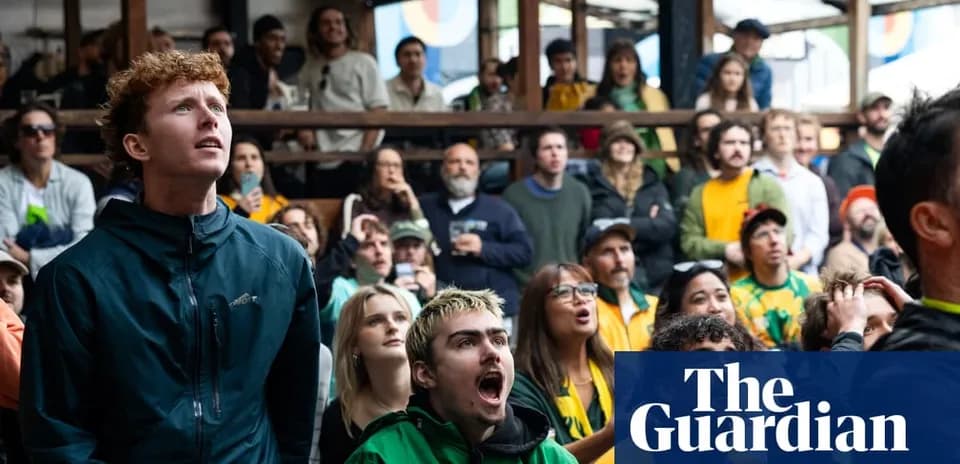 Crowd watching a sports event with intense expressions