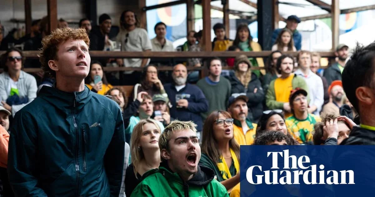 Crowd watching a sports event with intense expressions