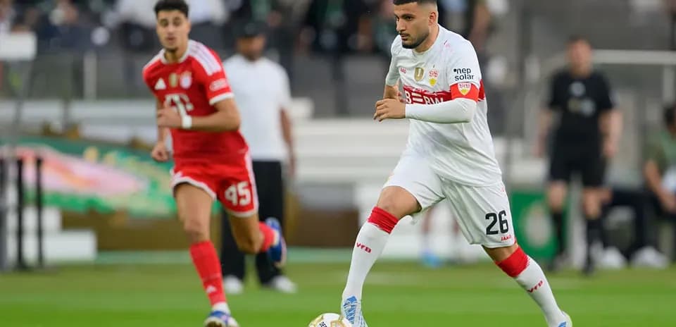 Player dribbling ball during a football match