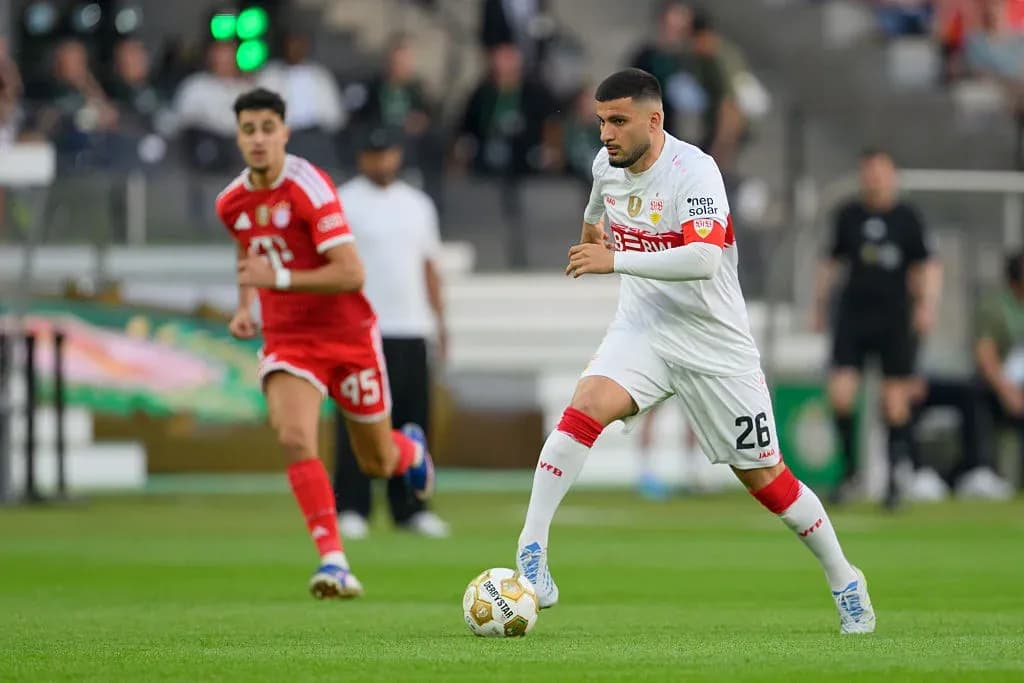 Player dribbling ball during a football match