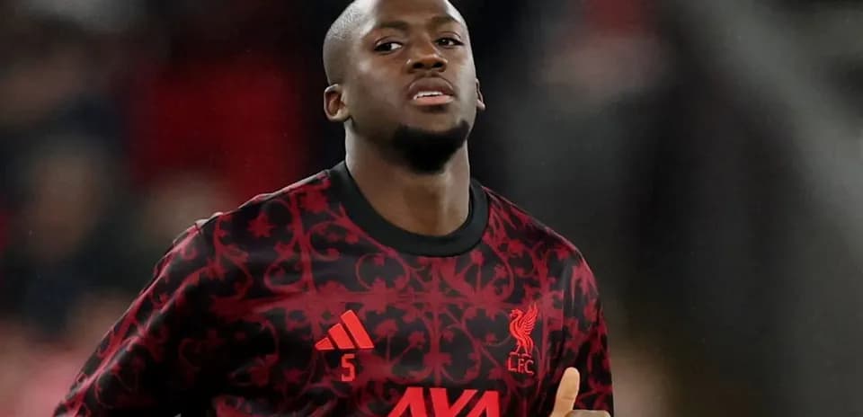Player warming up in Liverpool kit before match