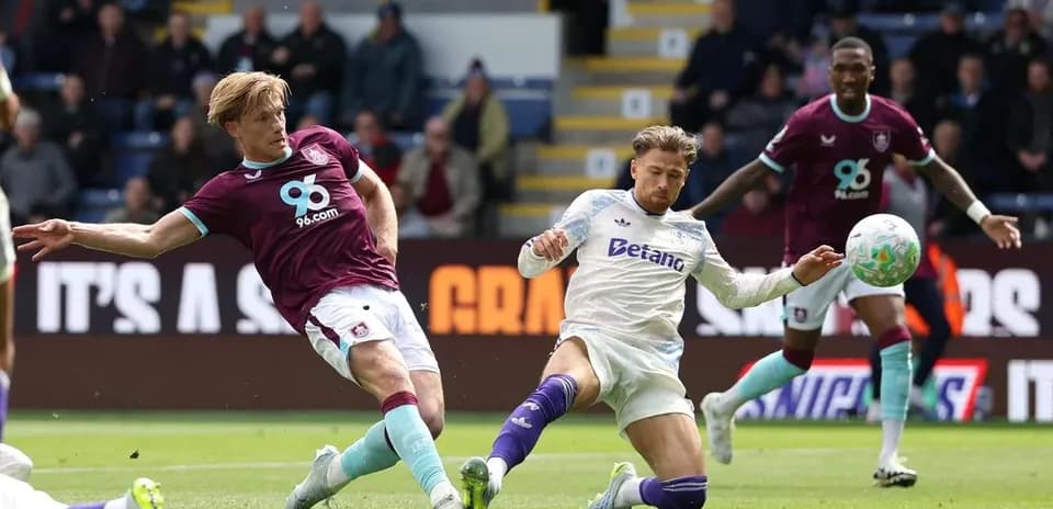 Burnley player tackles Aston Villa opponent