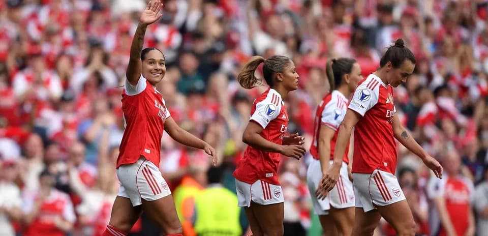 Arsenal women celebrating a goal during a match