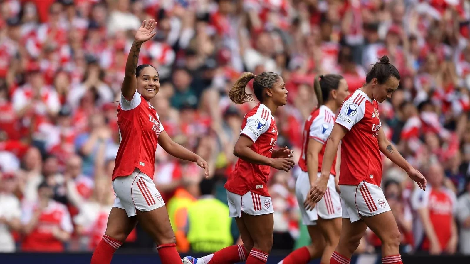 Arsenal women celebrating a goal during a match