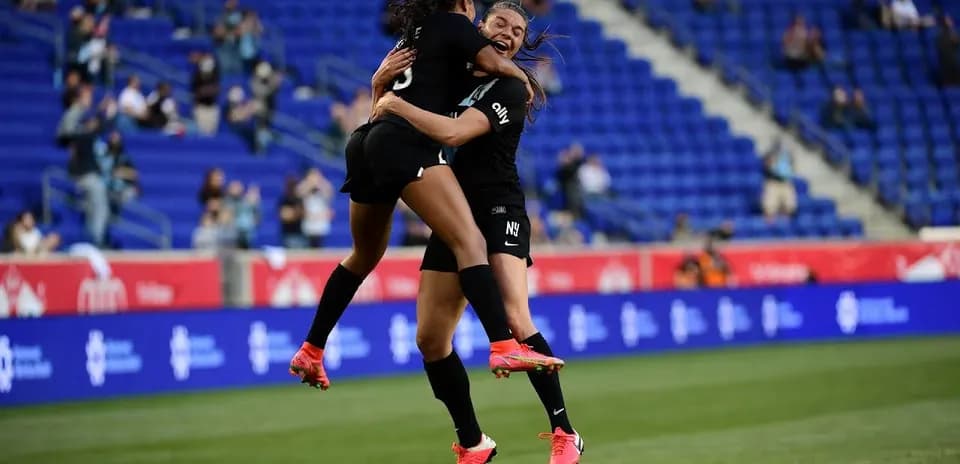 Players celebrating during Gotham FC match