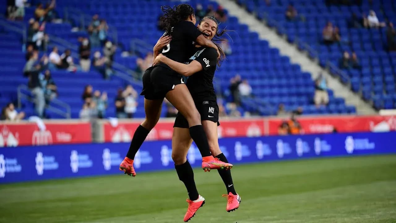 Players celebrating during Gotham FC match