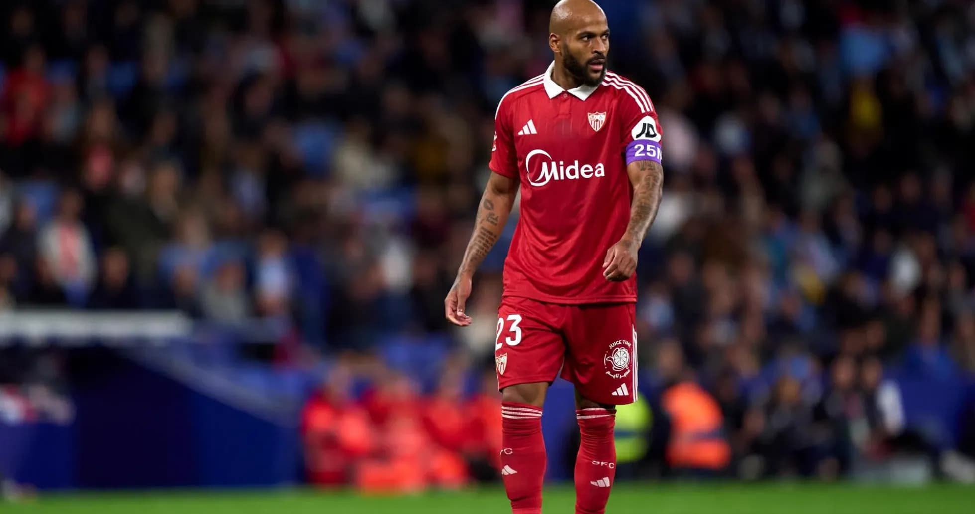 Player in red jersey during Sevilla match