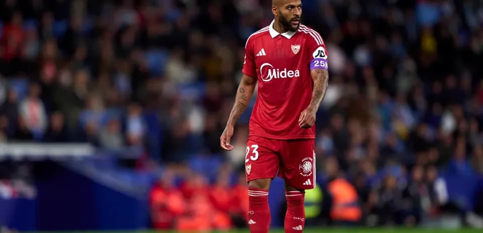 Player in red jersey during Sevilla match