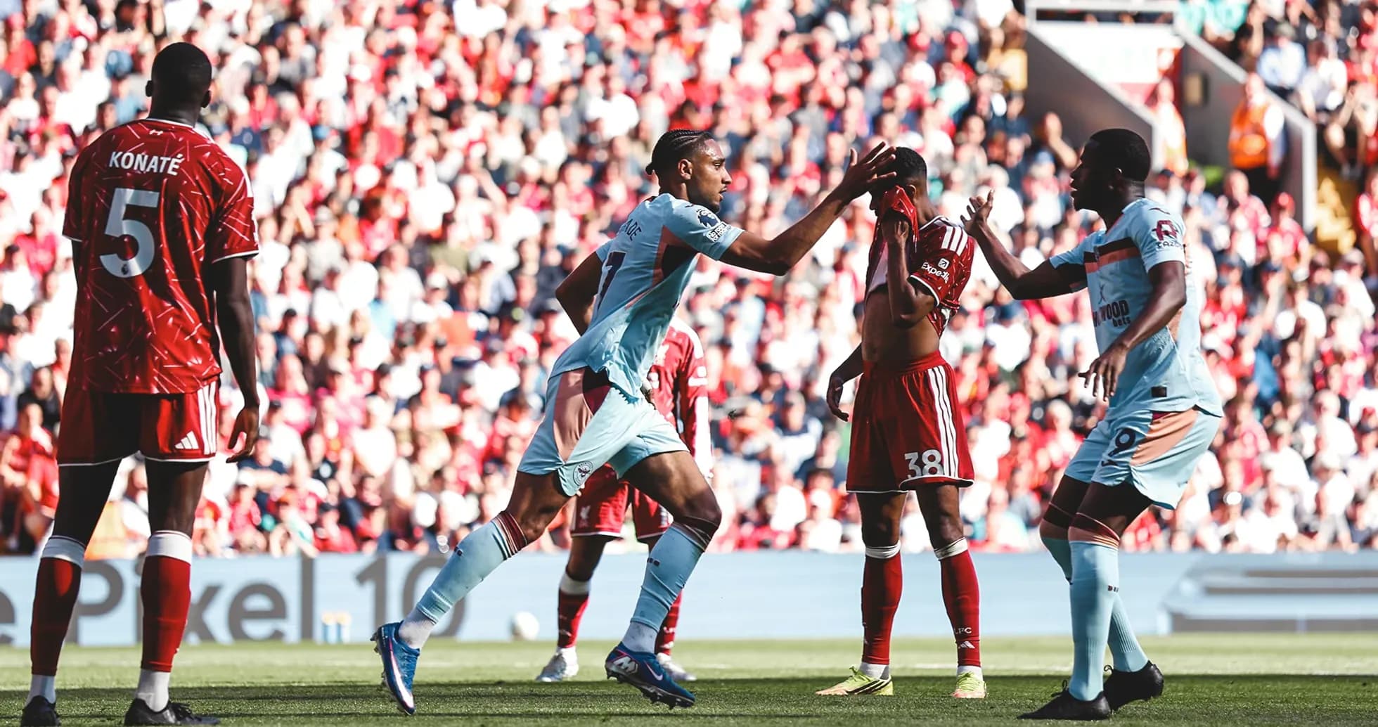 Brentford players celebrating during Liverpool match