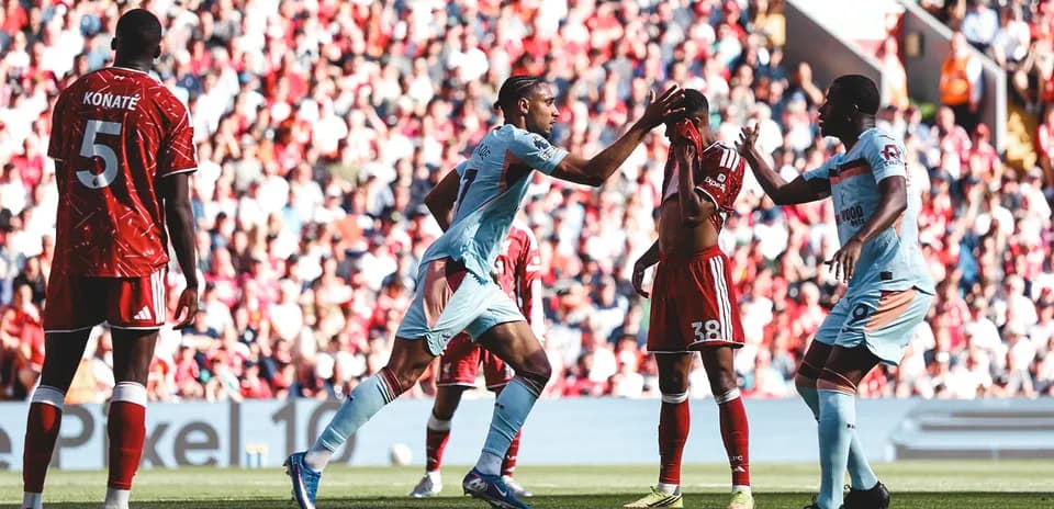 Brentford players celebrating during Liverpool match