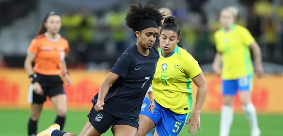 US and Brazil players competing for the ball
