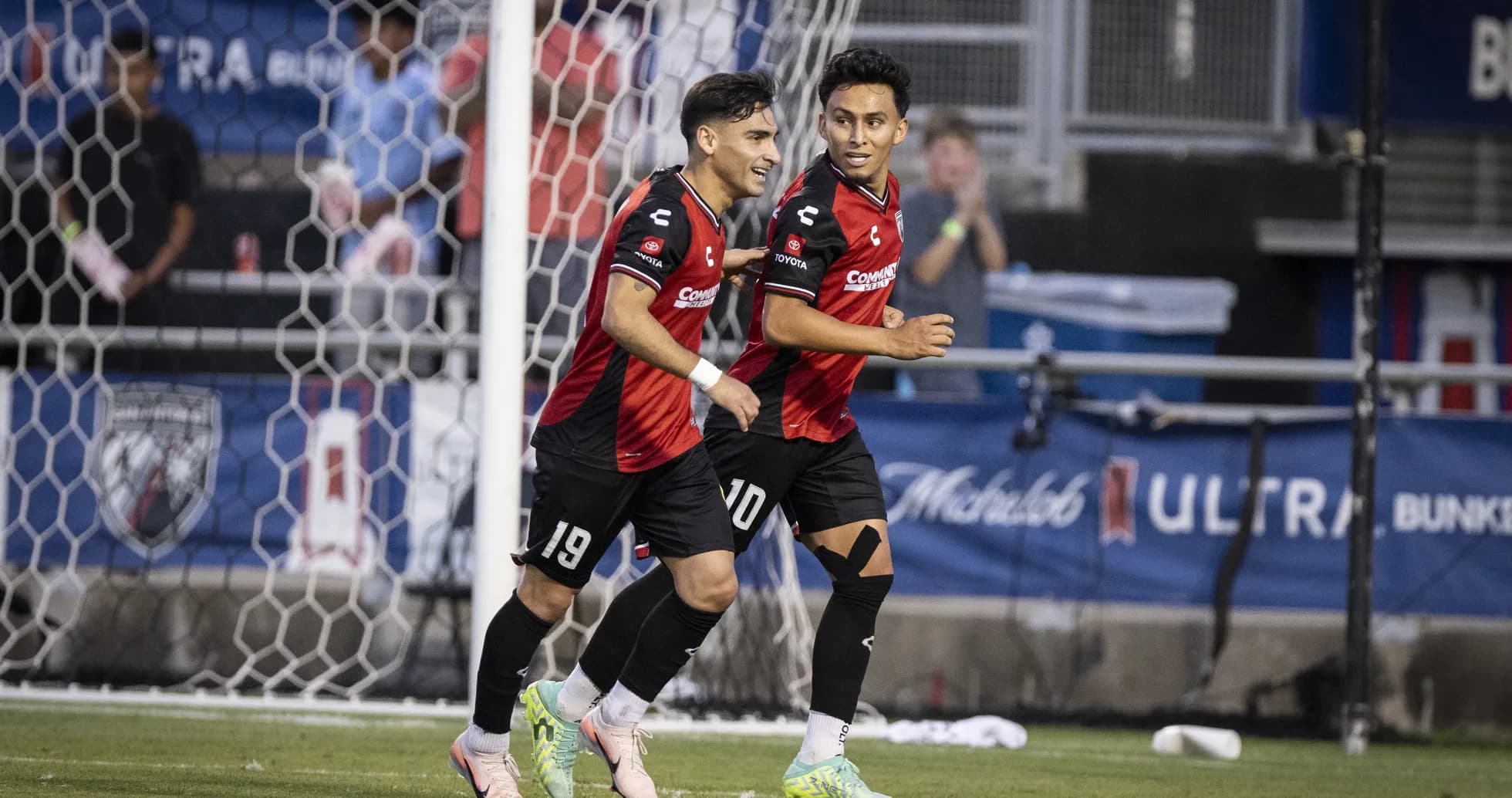 Players celebrating a goal during match