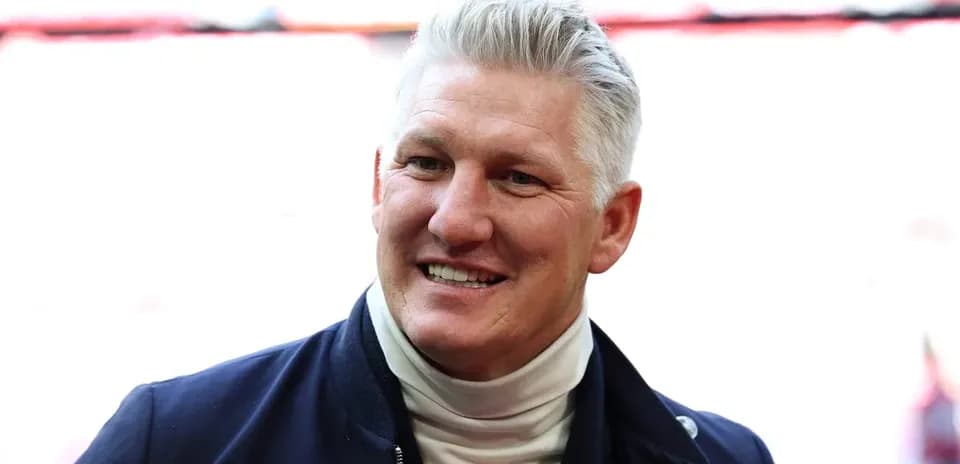 Former player smiling in stadium setting