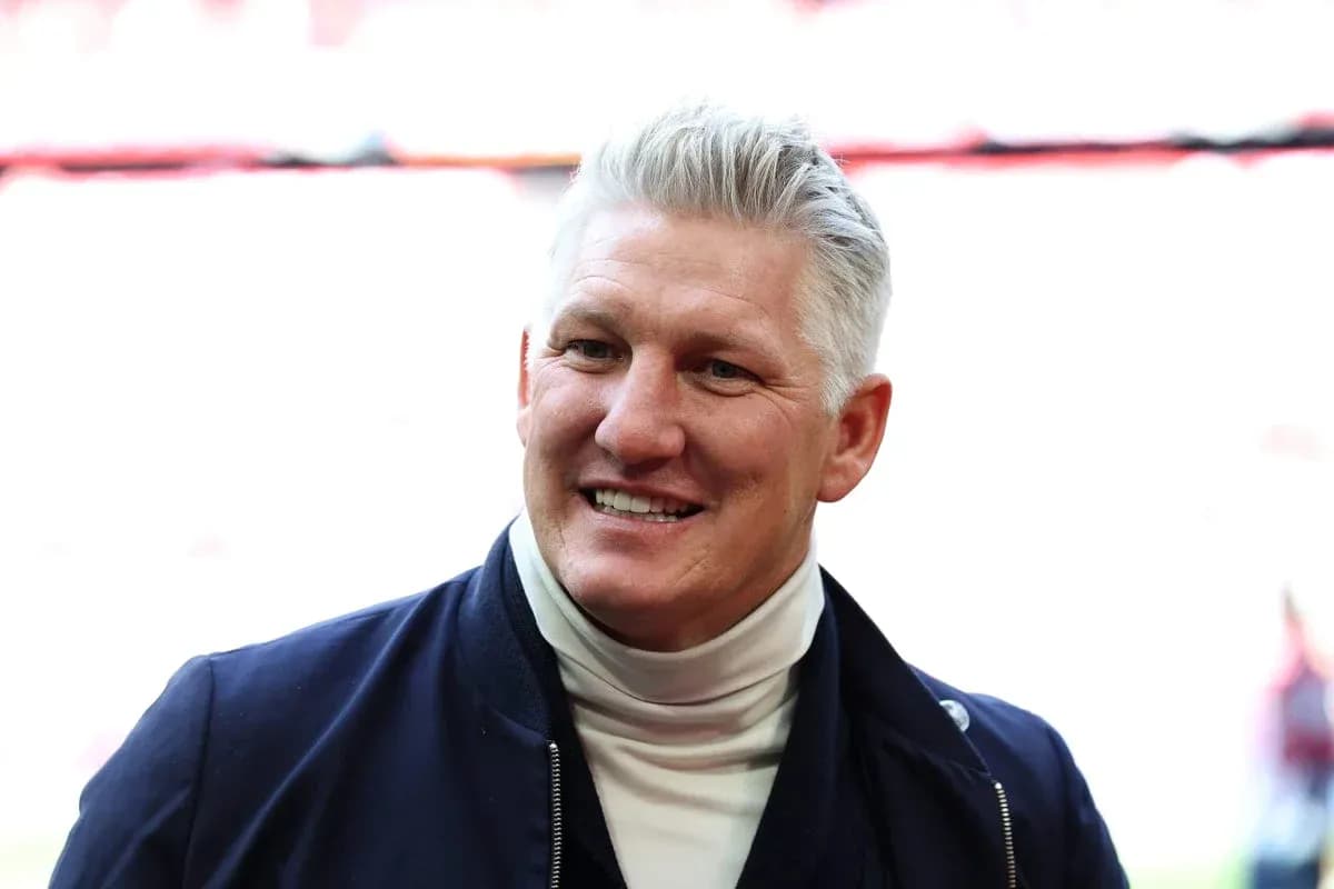 Former player smiling in stadium setting