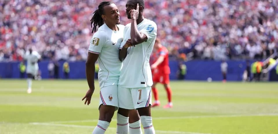 Two French players celebrating on the field