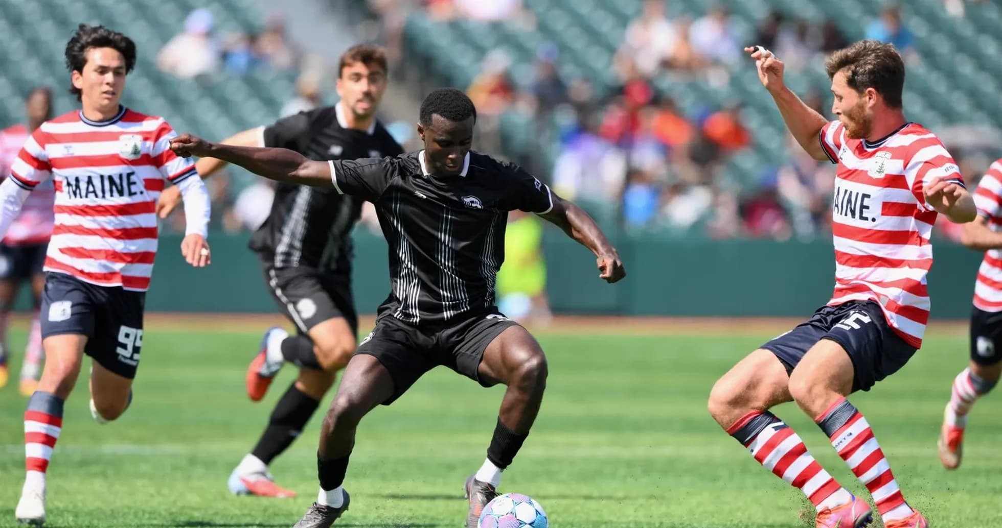 Players competing for the ball during match