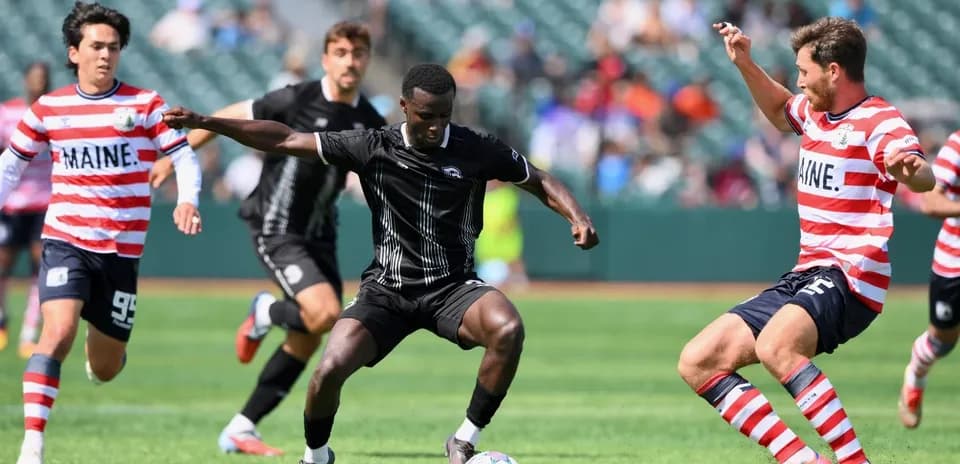 Players competing for the ball during match