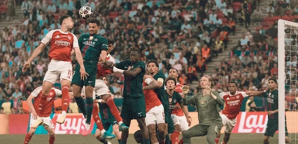 Players contesting a header during a corner kick