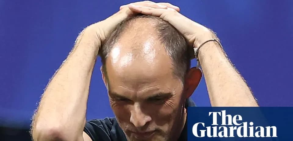 Coach holding head during tense moment