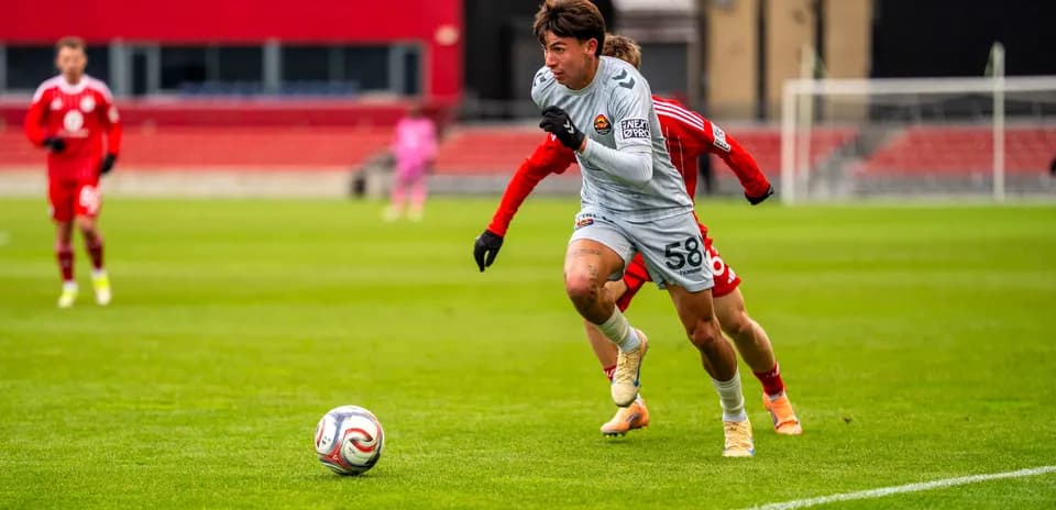 Player sprinting with the ball in a match
