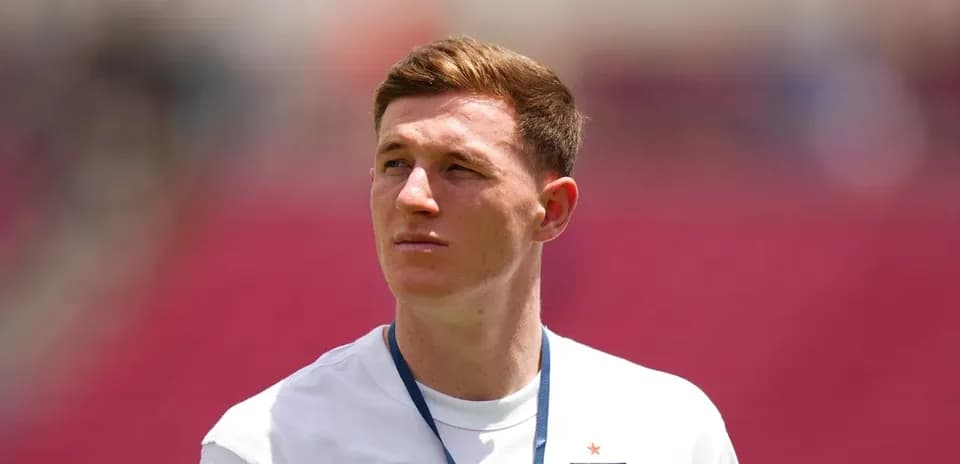Player wearing England jersey on the pitch